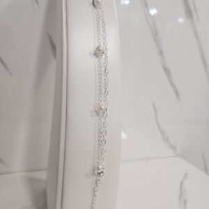 Pulsera doble perlas en espiral y corazones entrelazados