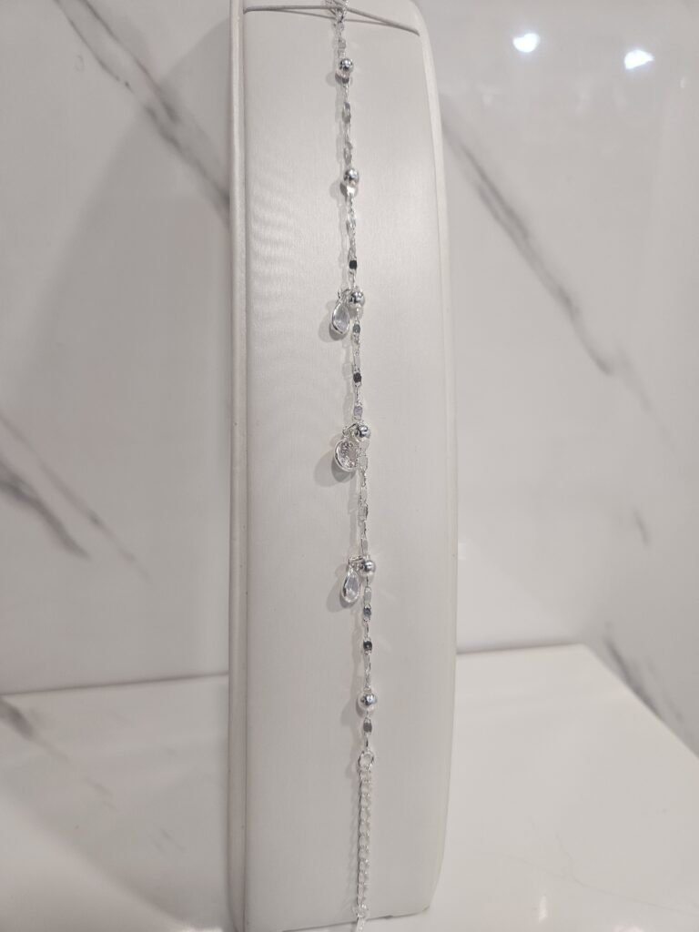 Pulsera guccimarina con bolitas y circones colgantes